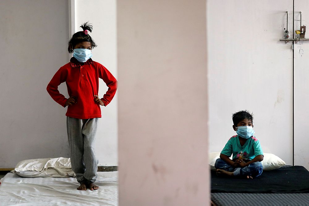 Children of migrant workers wear protective masks inside a sports complex turned into a shelter, in New Delhi, India April 4, 2020. u00e2u20acu201d Reuters pic