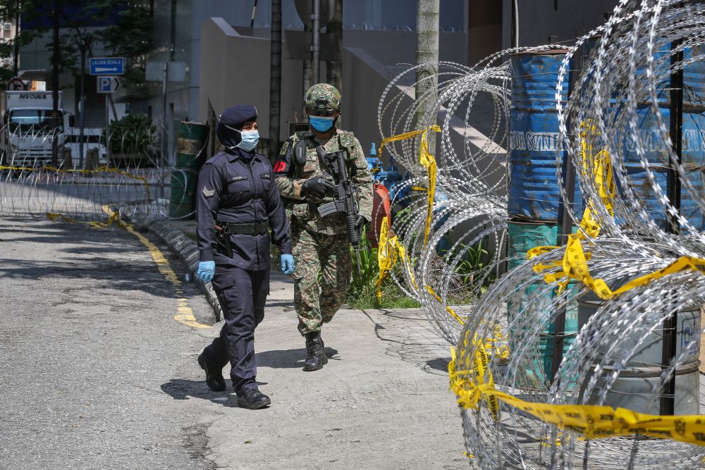 Armed Force and police personnel patrol the vicinity of Jalan Masjid India in Kuala Lumpur April 16, 2020. u00e2u20acu201d Picture by Yusof Mat Isa