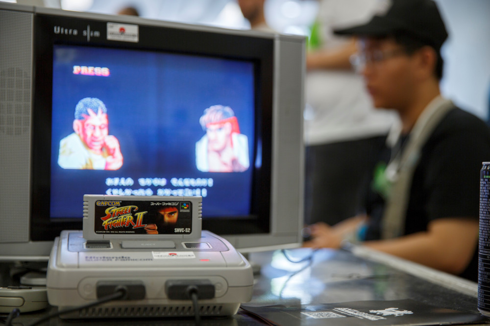 This photo taken August 12, 2017 shows a Nintendo Super Famicom, a 1990s era 16-bit console that was marketed outside Japan as the Super NES (Nintendo Entertainment System), running u00e2u20acu02dcStreet Fighter IIu00e2u20acu2122 at a retro gaming expo in Hong Kong. u00e2u20acu201d AFP pic 