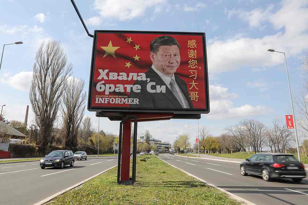 Cars drive by a billboard depicting Chinese President Xi Jinping in Belgrade, Serbia, April 1, 2020. The text on the billboard reads 'Thanks, brother Xi.' u00e2u20acu201d Reuters pic
