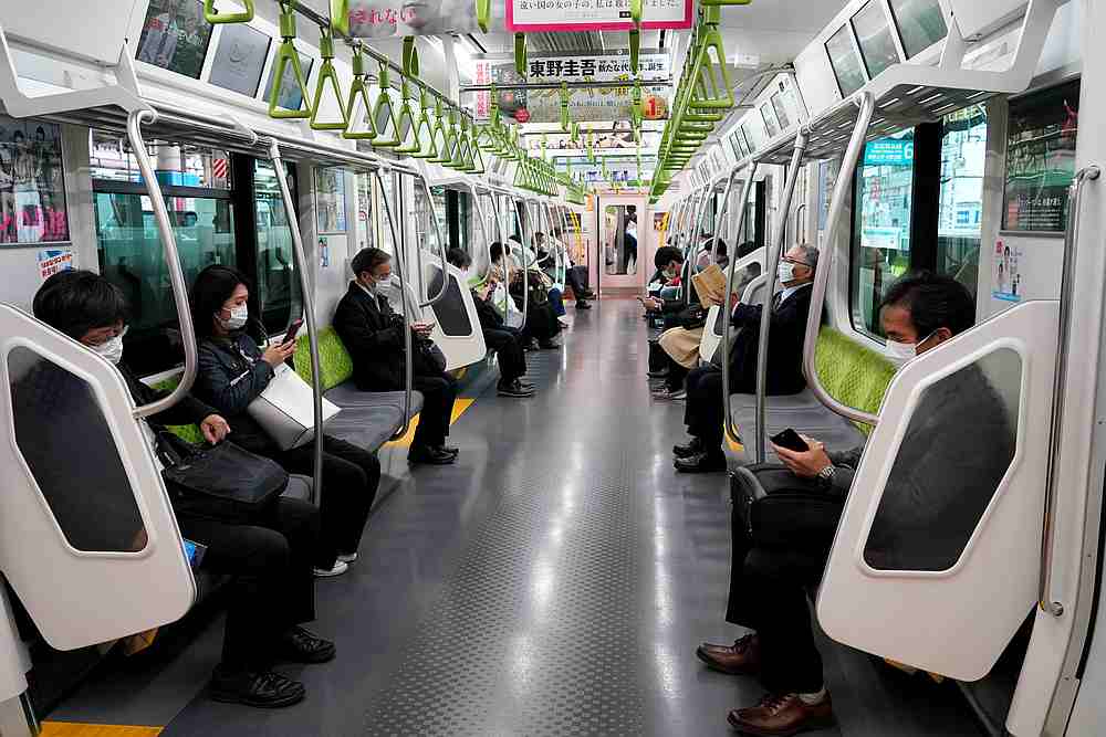 Passengers, wearing protective masks ride a train, following the outbreak of Covid-19, in Tokyo, Japan April 7, 2020. u00e2u20acu201d Reuters pic
