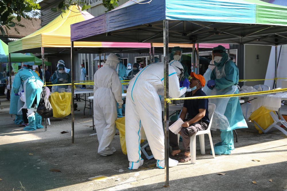 Health workers test foreign workers for Covid-19 at Kampung Baru, Kuala Lumpur April 16, 2020. u00e2u20acu201d Picture by Yusof Mat Isa