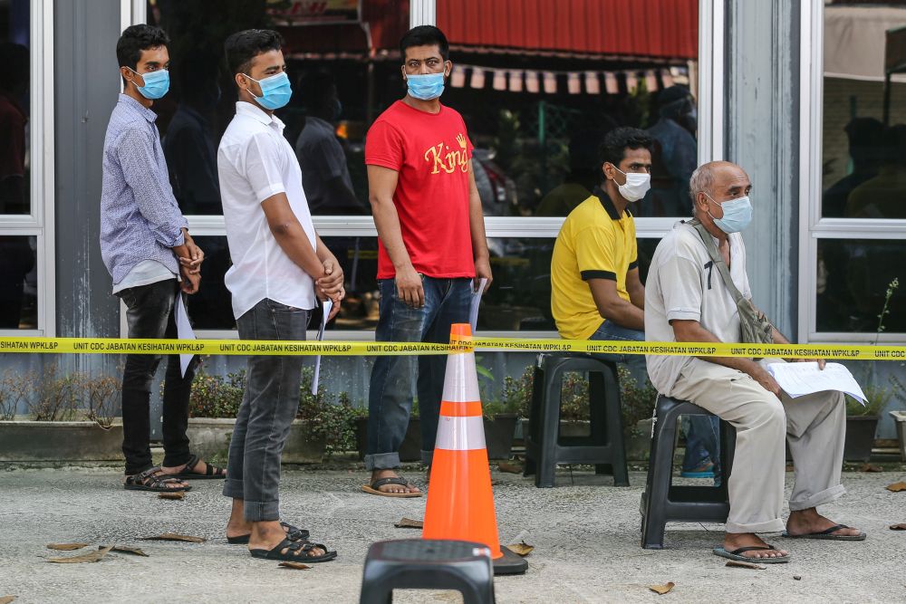 Foreign workers queue up to be tested for Covid-19 at Kampung Baru, Kuala Lumpur April 16, 2020. u00e2u20acu201d Picture by Yusof Mat Isa
