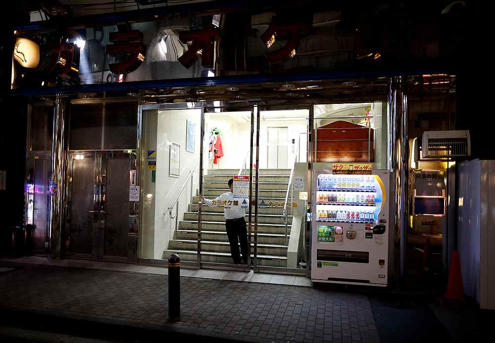 A man closes the entrance of a voluntarily closed karaoke booths building to keep the Covid-19 threat in check, near Tokyo Station, Japan April 3, 2020. u00e2u20acu201d Reuters pic