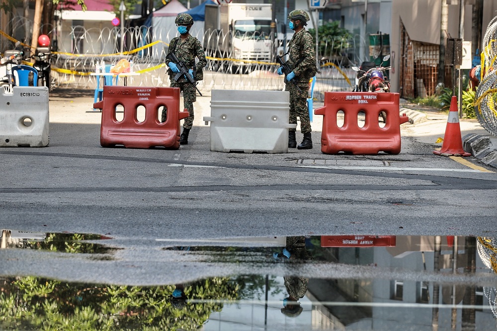 Armed Forces personnel patrols the vicinity of Jalan Masjid India in Kuala Lumpur April 18, 2020. u00e2u20acu201d Picture by Ahmad Zamzahuri