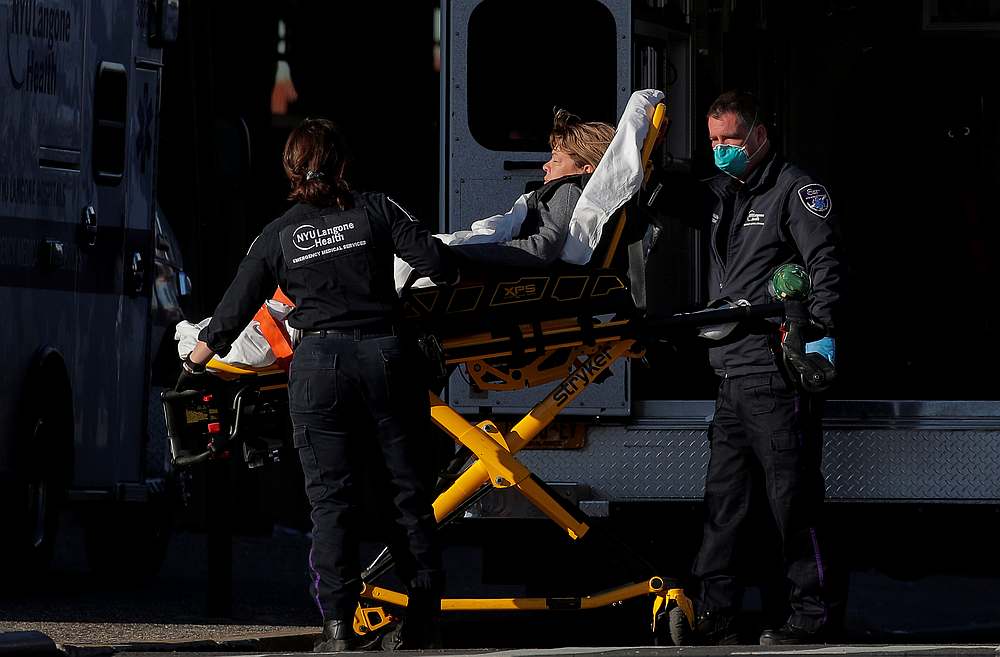 Emergency Medical Services paramedics unload a patient at NYU Langone Hospital-Brooklyn in New York April 22, 2020. u00e2u20acu201d Reuters pic