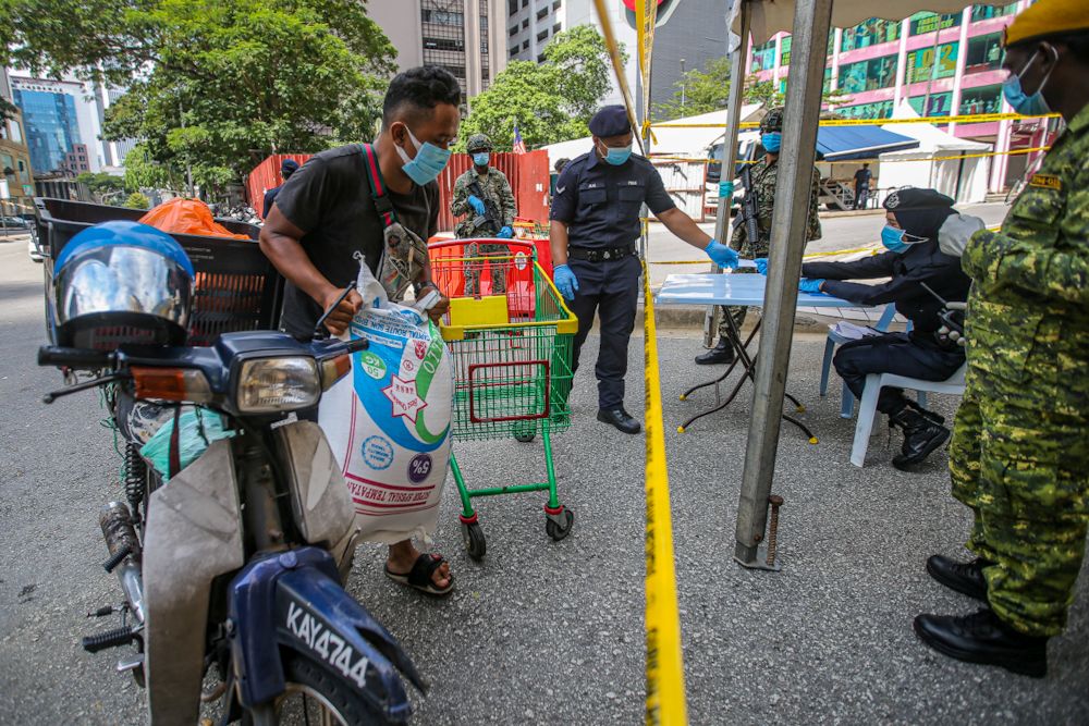 People drop off food and basic necessities at Masjid India, Kuala Lumpur amid the enhanced movement control order April 15, 2020. u00e2u20acu2022 Picture by Hari Anggara