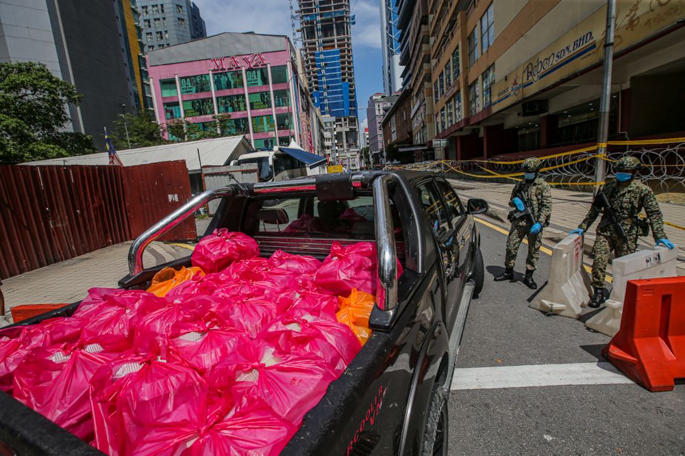 People drop off food and basic necessities at Masjid India, Kuala Lumpur amid the enhanced movement control order April 15, 2020. u00e2u20acu2022 Picture by Hari Anggara
