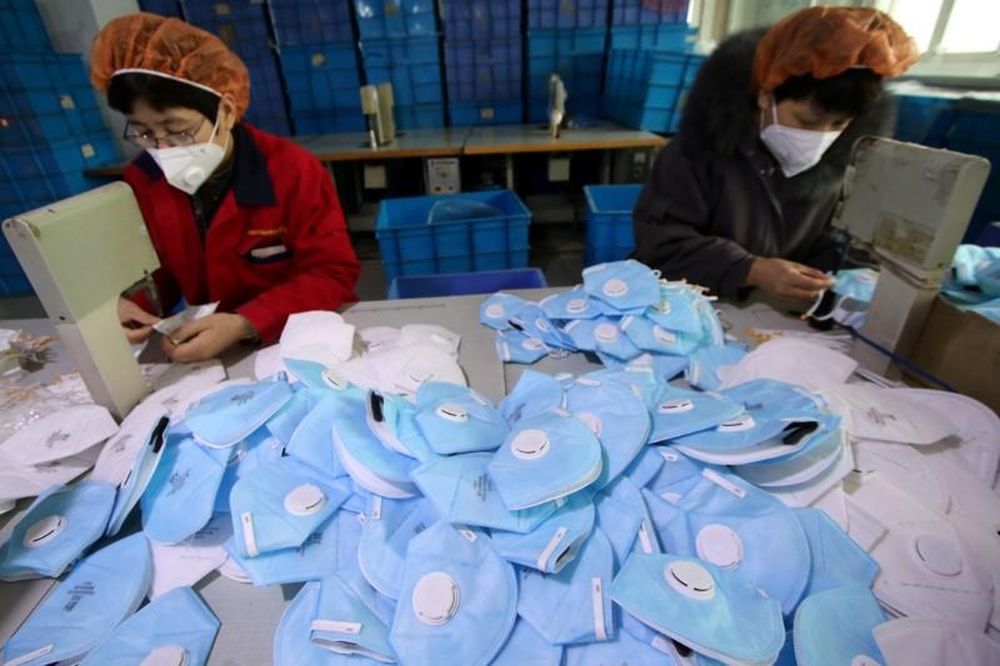Workers make protective masks at a factory in Handan, Hebei province, China, January 22, 2020. u00e2u20acu201d China Daily picture via Reuters