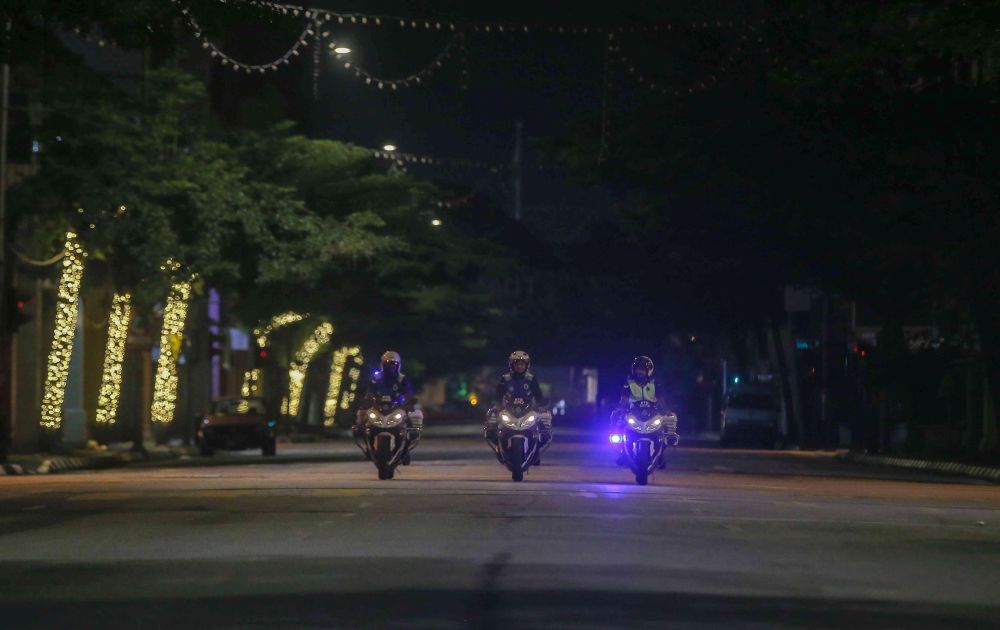 Policemen patrol the streets of Ipoh as the movement control order enters phase three on April 15, 2020. u00e2u20acu201d Picture by Farhan Najib