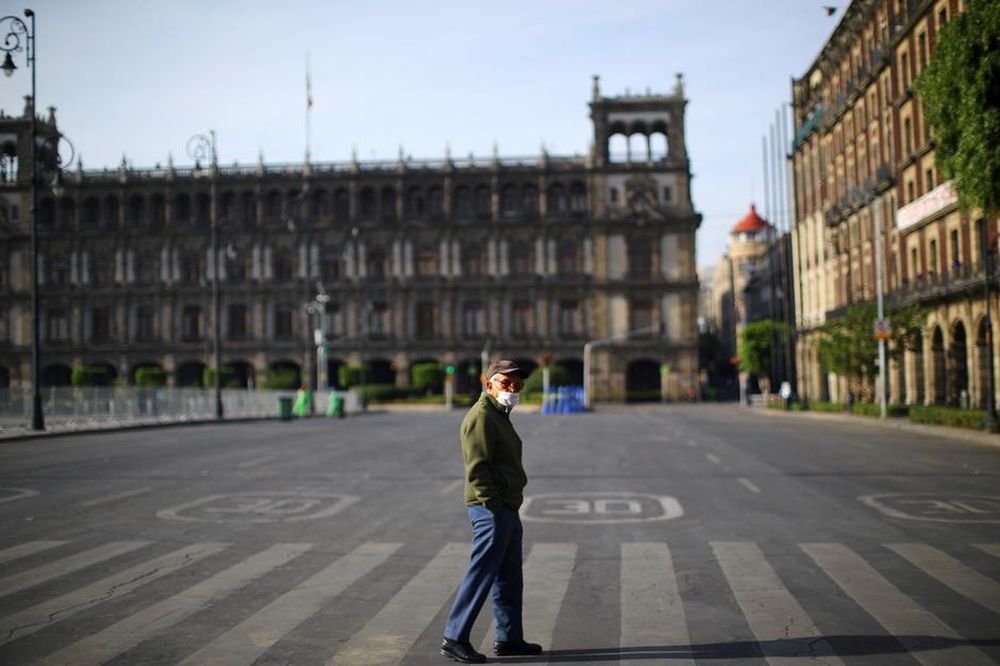 A man wearing a protective mask walks on an empty street during the coronavirus disease (Covid-19) outbreak in Mexico City, Mexico April 12, 2020. u00e2u20acu201d Reuters pic