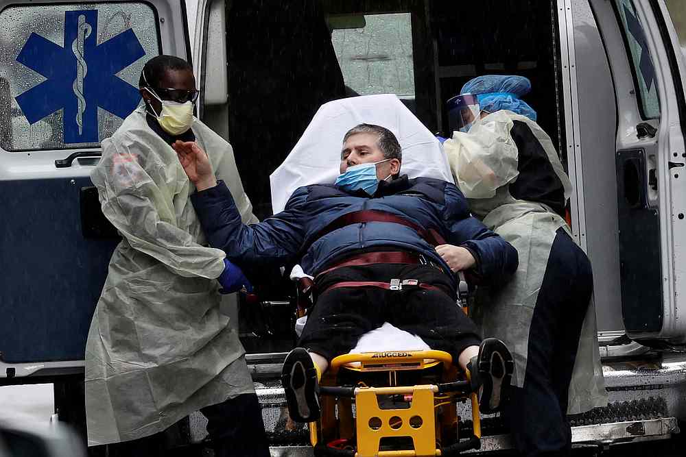 A patient is transported at the emergency entrance outside Mount Sinai Hospital in Manhattan, New York April 13, 2020. u00e2u20acu201d Reuters pic
