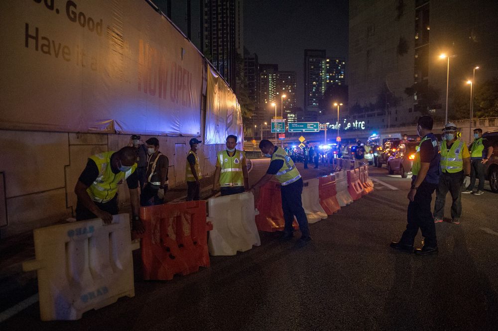 Petaling Jaya District Police with Petaling Jaya City Council officials preparing a road closure at Mutiara Damansara following Phase Two of the MCO to prevent the spread of the Covid-19, April 9, 2020. u00e2u20acu201d Bernama pic