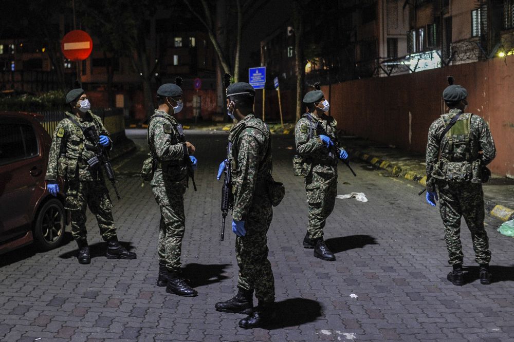 Armed Forces personnel patrol the vicinity of the Selayang wet market April 8, 2020.u00e2u20acu201d Picture by Shafwan Zaidon
