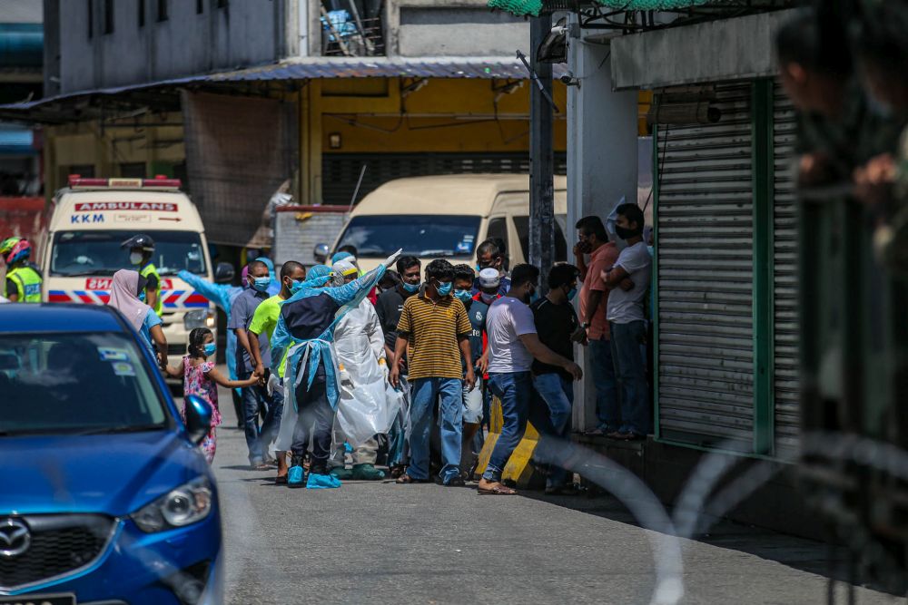 Health workers test residents near the Selayang wholesale market for Covid-19 in Kuala Lumpur April 21, 2020. u00e2u20acu201d Picture by Hari Anggara