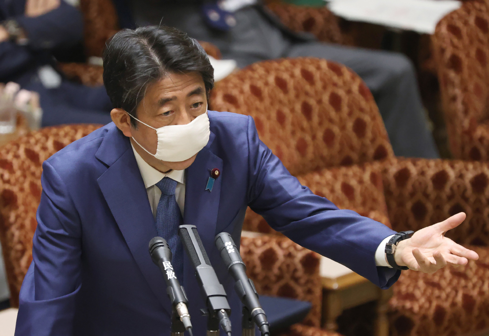 Japanu00e2u20acu2122s Prime Minister Shinzo Abe wearing a face mask answers questions during a upper house budget committee session at the parliament in Tokyo April 30, 2020. u00e2u20acu201d AFP pic 