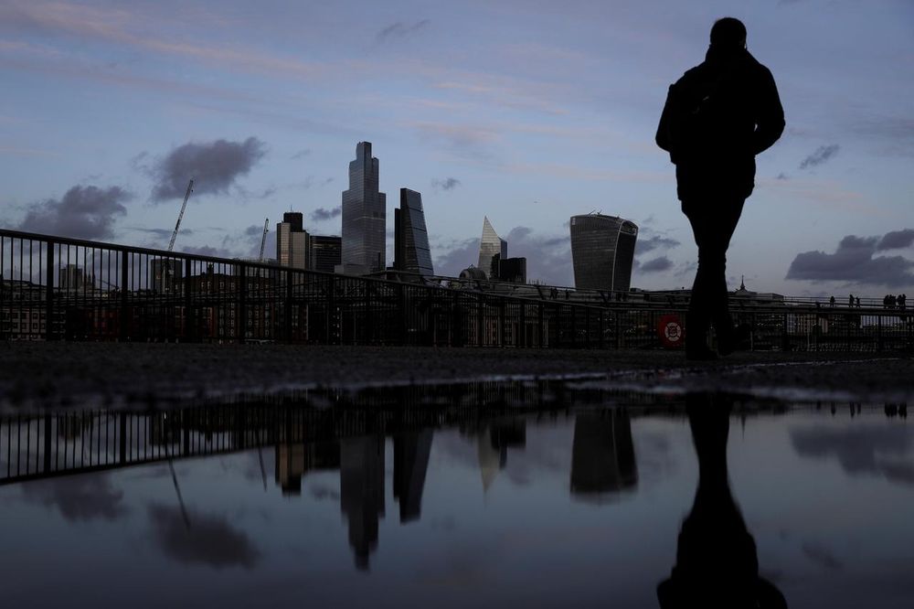 Pedestrians walk along the Southbank in view of skyscrapers in the financial district in London, February 17, 2020. u00e2u20acu201d Reuters pic