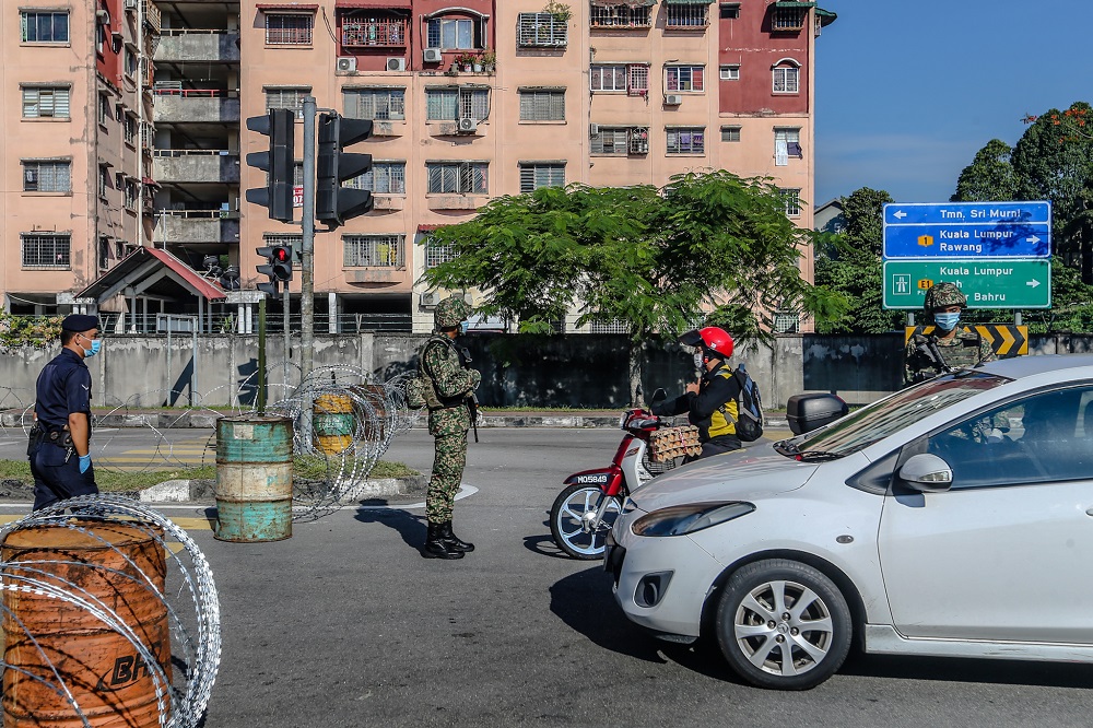 Armed Forces personnel man a roadblock at Taman Sri Murni in Selayang during the movement control order (MCO) in Kuala Lumpur April 20, 2020. u00e2u20acu2022 Picture by Firdaus Latif  