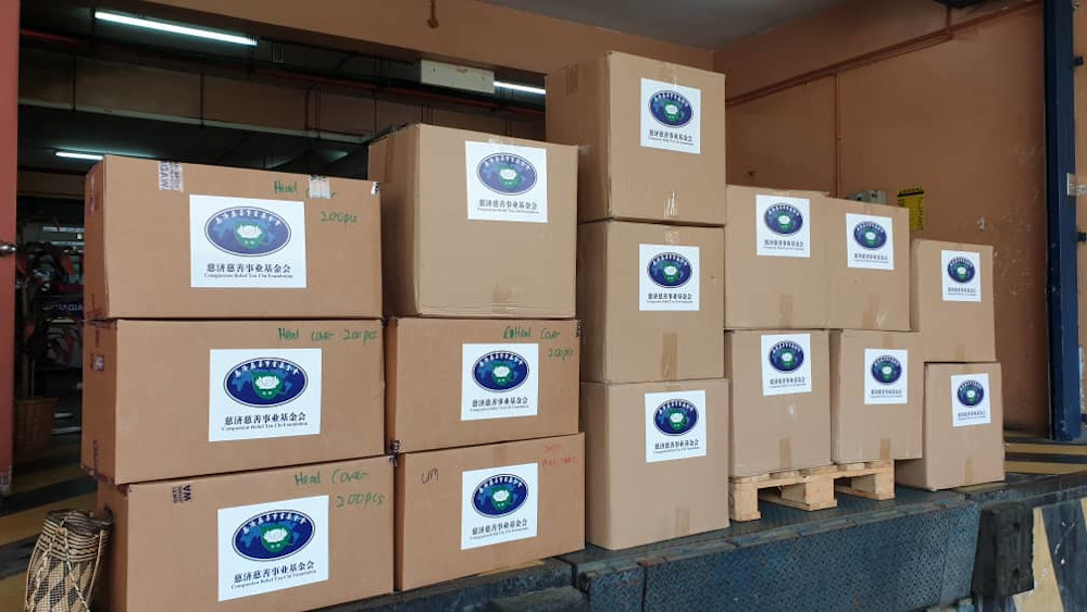 Tzu Chi has delivered 1,000 pieces of head cover and 500 pieces of protective coverall jumpsuits to UMMC. — Picture courtesy of Tzu Chi Foundation Malaysia