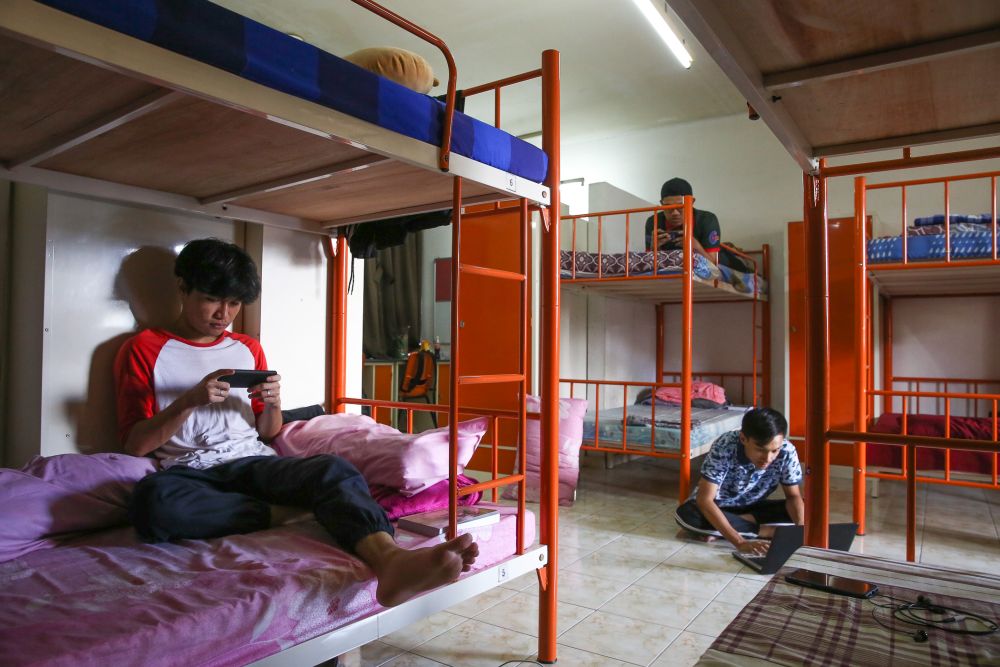 Universiti Teknologi Mara students lounge at their dormitory room during the third phase of the movement control order in Shah Alam April 22, 2020. u00e2u20acu201d Picture by Yusof Mat Isa
