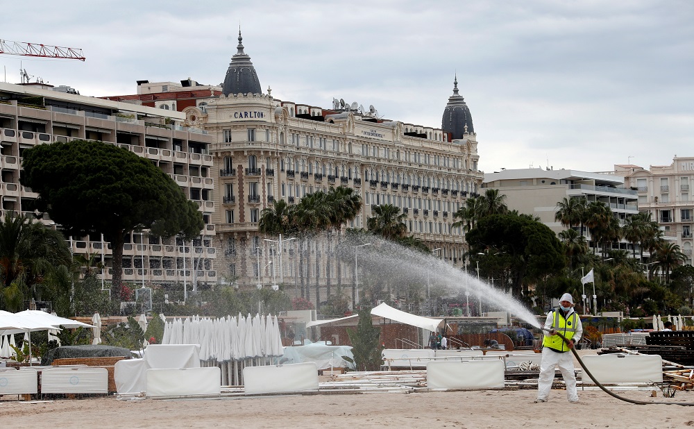 A disinfection squad sprays disinfectant to clean the beach on the Croisette in Cannes after France reopened its beaches following the outbreak of the coronavirus disease in France May 29, 2020. u00e2u20acu201d Reuters pic