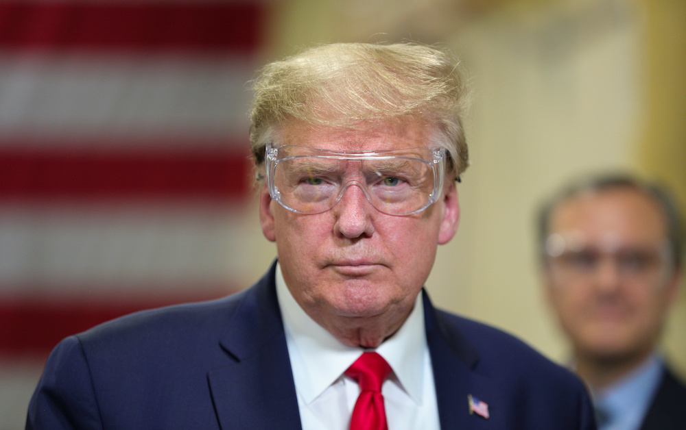 US President Donald Trump looks at an assembly line during a tour of Honeywell's facility manufacturing protective face masks for the coronavirus disease (Covid-19) outbreak in Phoenix, Arizona May 5, 2020. u00e2u20acu201d Reuters pic