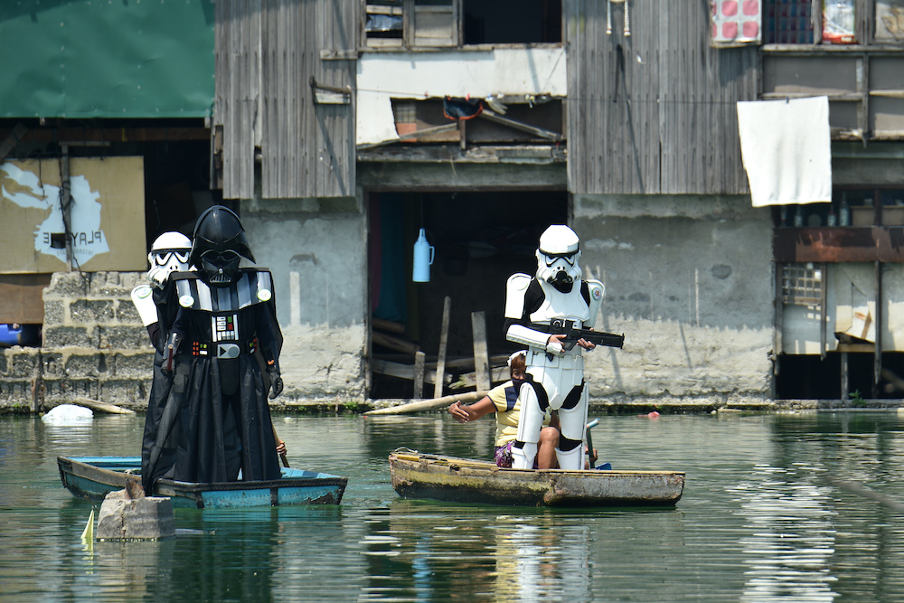 Local youth representatives dressed Stormtroopers and Darth Vader patrol in wooden boats around a submerged village to remind residents to stay at home during the enhanced community quarantine in suburban Manila May 6, 2020. u00e2u20acu201d AFP pic