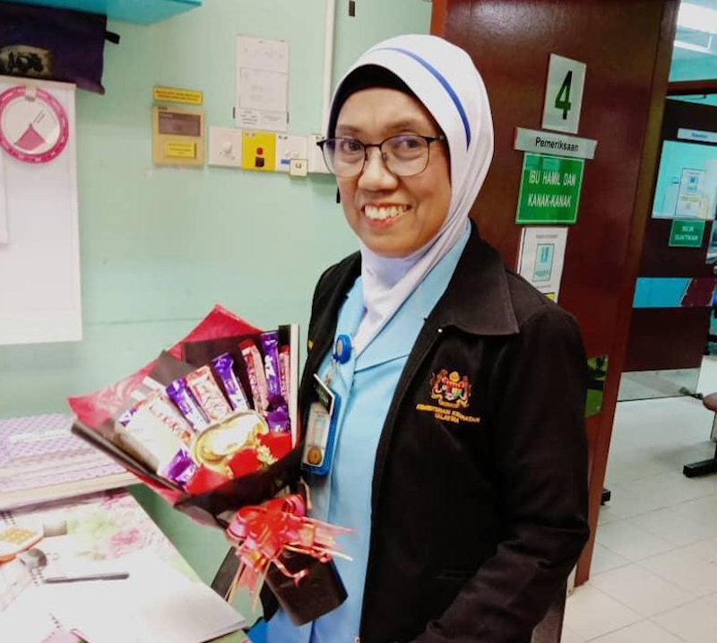 Syabilu00e2u20acu2122s mother, Faridah Mohamed Husin, has to work double time since the Covid-19 pandemic. u00e2u20acu201d Picture courtesy of Syabil Nazim Zainal Abidin