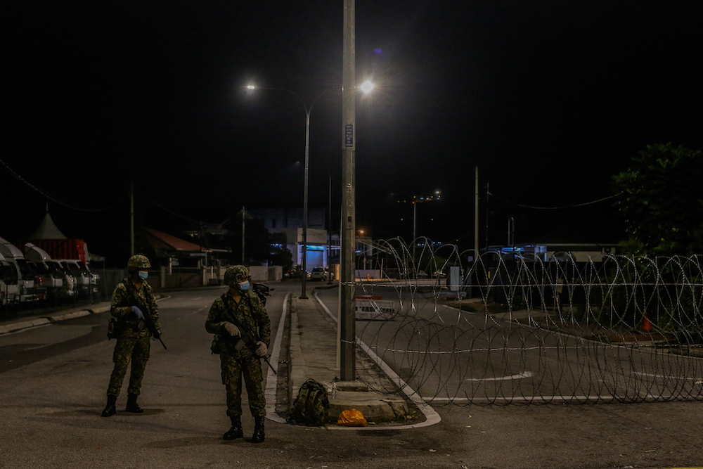 Armed Forces personnel patrol Petaling Jaya Old Town that is now under lockdown to curb the spread of Covid-19 May 10, 2020. u00e2u20acu201d Picture by Firdaus Latif