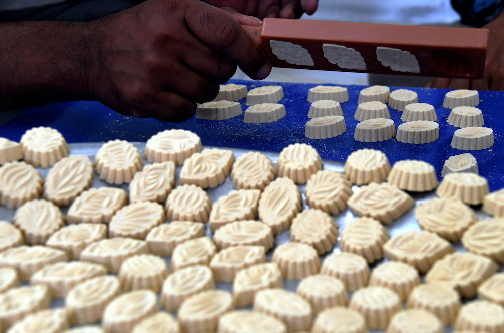 Norhaini Mat Darus makes the traditional putu kacang hijau for Hari Raya every year. u00e2u20acu201d Bernama pic 