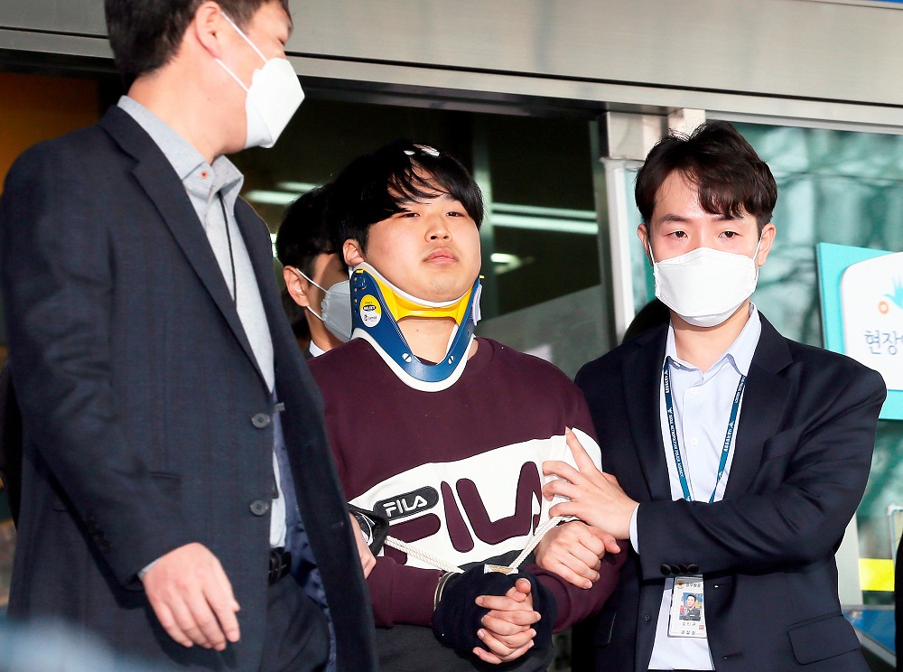 Head of an online sexual blackmail ring called 'Nth room', Cho Ju-Bin (centre) leaves Jongno police station to be transferred to the prosecution for further investigation in Seoul, March 25, 2020. u00e2u20acu201d Picture by POOL/AFLO via Reuters 