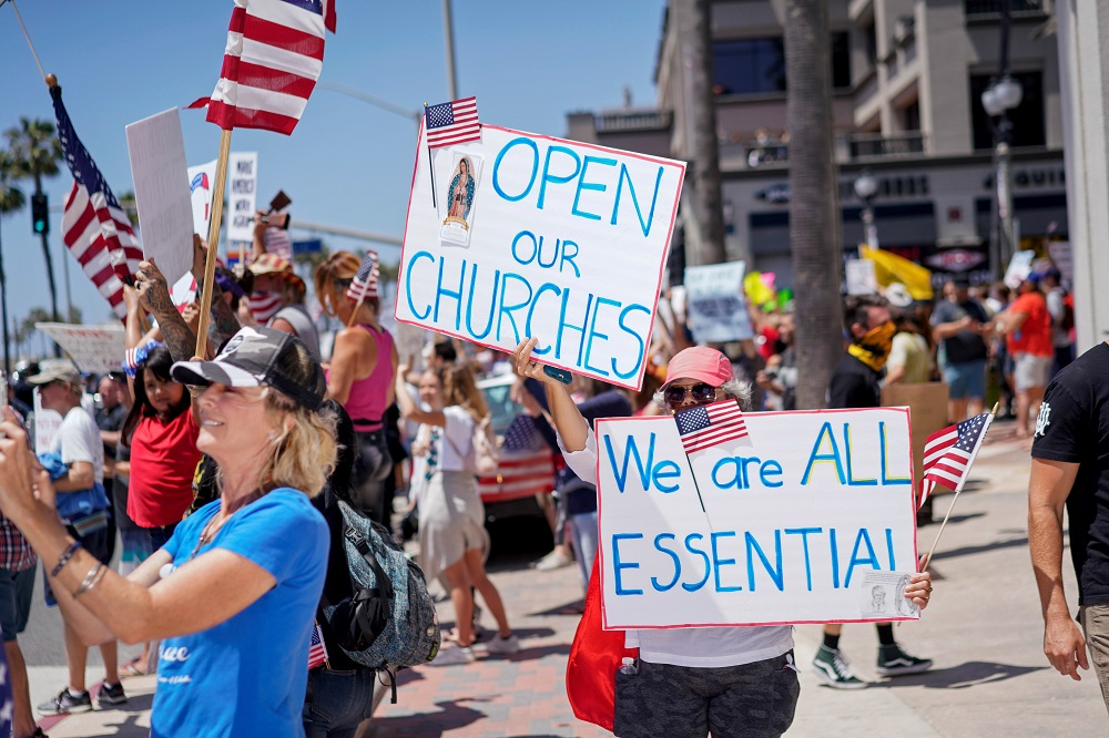 People gather near Huntington Beach Pier to protest Governor Gavin Newsomu00e2u20acu2122s order to temporarily close state and local beaches in Orange County, California May 1, 2020. u00e2u20acu201d Reuters pic
