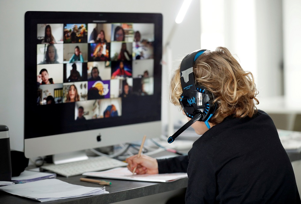 A student takes online classes at home, with his companions, using the Zoom app during the coronavirus disease outbreak in El Masnou in Spain April 2, 2020. u00e2u20acu201d Reuters pic