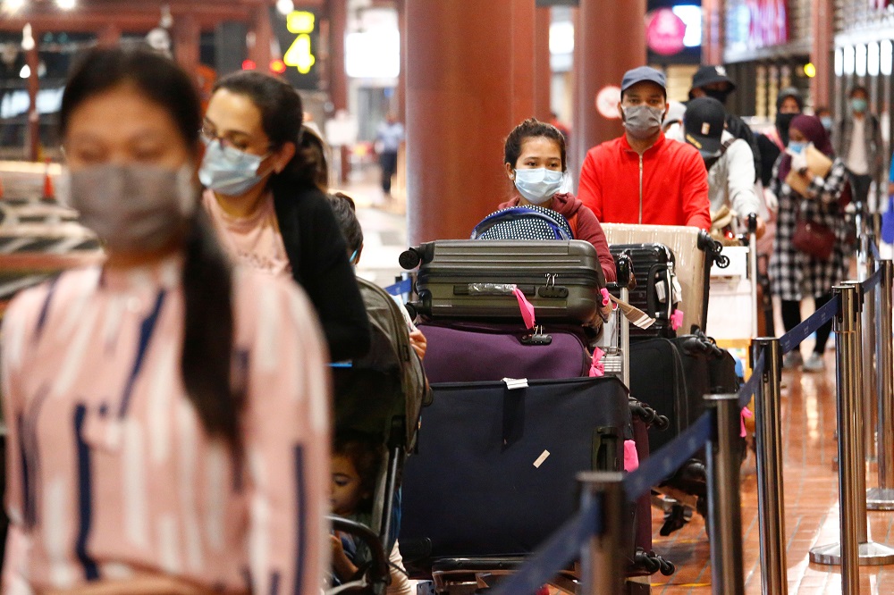 Passengers stand in line to have documents checked at a Soekarno Hatta Airport amid the coronavirus disease outbreak in Jakarta May 21, 2020. u00e2u20acu201d Reuters pic