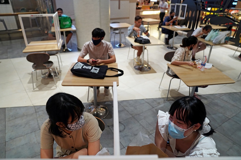 People eat lunch at a food court of a department store, after the Thai government eased isolation measures to prevent the spread of the coronavirus disease in Bangkok May 21, 2020. u00e2u20acu201d Reuters pic