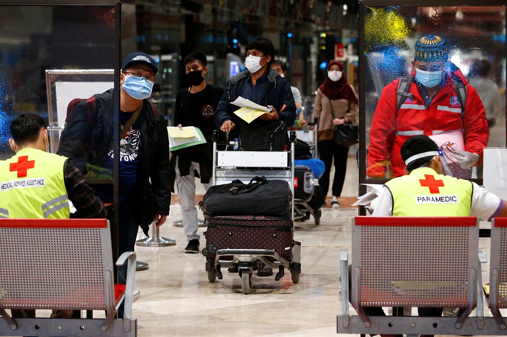 Passengers stand in line to have documents checked at a Soekarno Hatta Airport amid the coronavirus disease outbreak in Jakarta May 21, 2020. u00e2u20acu201d Reuters pic