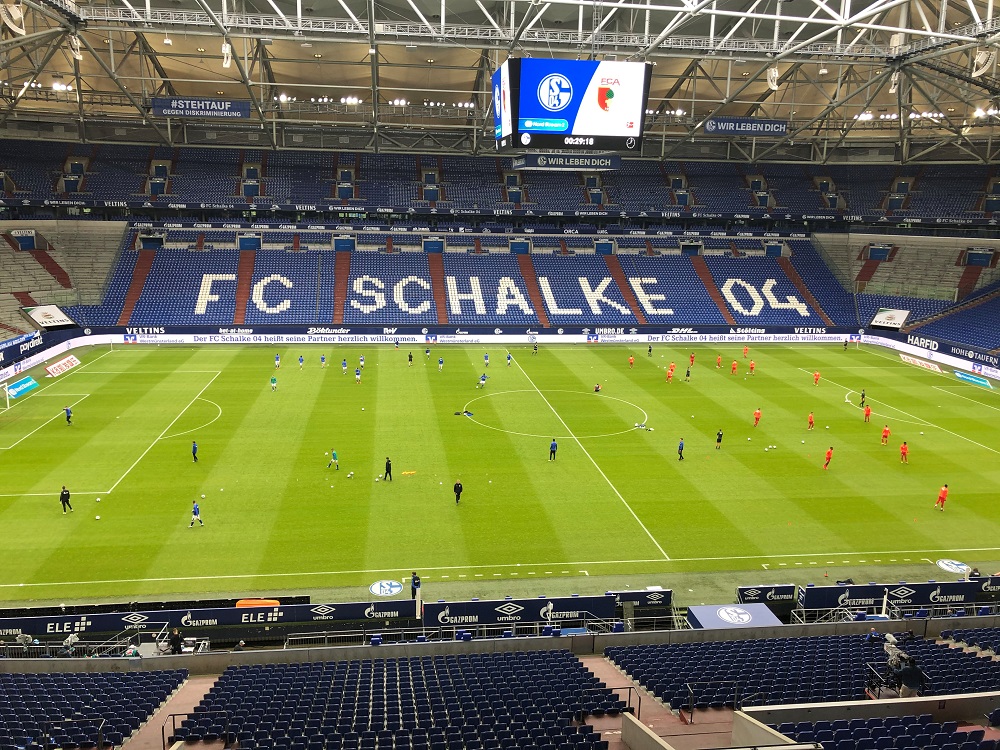 General view of players warming up before the match between Schalke 04 and FC Augsburg at the Veltins-Arena in Gelsenkirchen, Germany May 24, 2020. u00e2u20acu201d Picture by Ulli Brunger/Pool via Reuters
