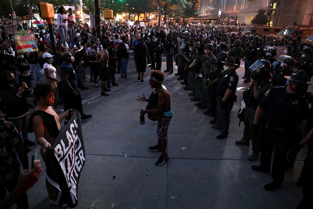 A man speaks to protesters during a protest against the death in Minneapolis police custody of African-American man George Floyd, in Atlanta, Georgia, US May 29, 2020. — Reuters pic