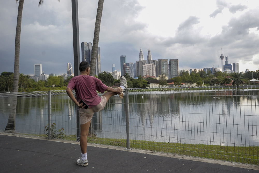 Mr Ong, 68, is seen exercising at the Titiwangsa lake park in Kuala Lumpur May 4, 2020. u00e2u20acu201d Picture by Shafwan Zaidon