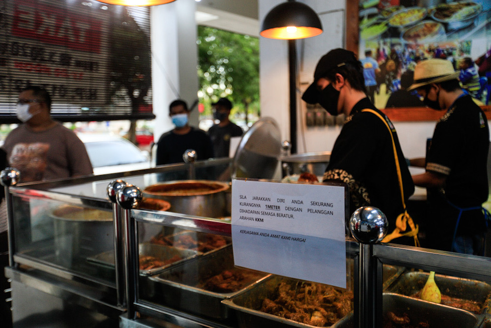 A sign on social distancing is seen at Restoran Nasi Kandar Kayu, Jalan Todak, Penang on May 5, 2020. u00e2u20acu201d Picture by Sayuti Zainudin