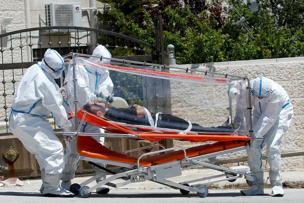 Palestinian health workers wearing protective suits take part in a drill for dealing with coronavirus cases, amid concerns about the spread of the disease (COVID-19), in Ramallah in the Israeli-occupied West Bank April 23, 2020. u00e2u20acu201d Reuters pic