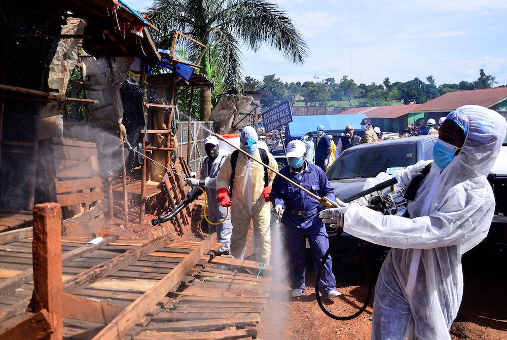 Ugandan health officials wearing protective gear disinfect the Nakawa open-air market as part of the measures to prevent the spread of the coronavirus disease (Covid-19), within in Nakawa division of Kampala April 17, 2020. u00e2u20acu201d Reuters picnn