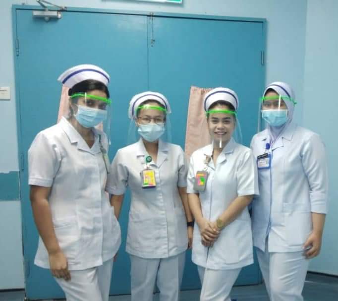 Nurses from Kuala Lumpur Hospital donning the face shields made by Vishan. — Picture by Vishan Nair.