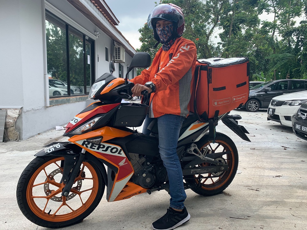 Roadblocks are an additional factor to take into account for Sapri to make his deliveries on time. — Picture courtesy of Lalamove
