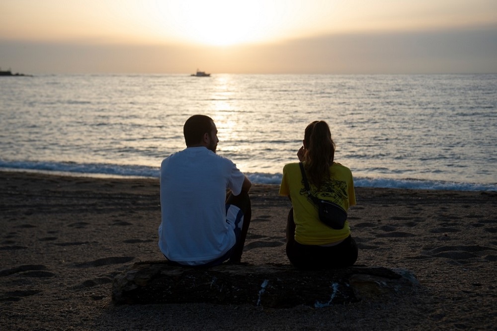 A couple looks at the sea at La Barceloneta Beach in Barcelona, on May 8, 2020, opened for the first time since Spain declared a state of emergency due to the Covid-19 outbreak. u00e2u20acu201d AFP pic