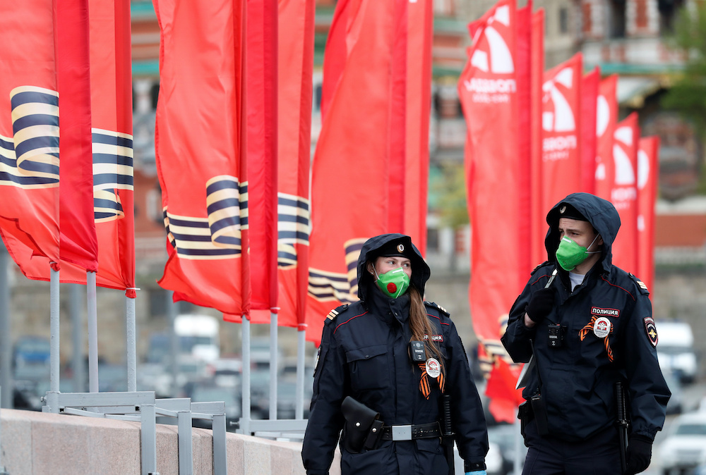 Police officers wearing protective face masks patrol streets during the celebrations of Victory Day, amid the outbreak of the coronavirus disease in Moscow,May 9, 2020. u00e2u20acu201d Reuters pic