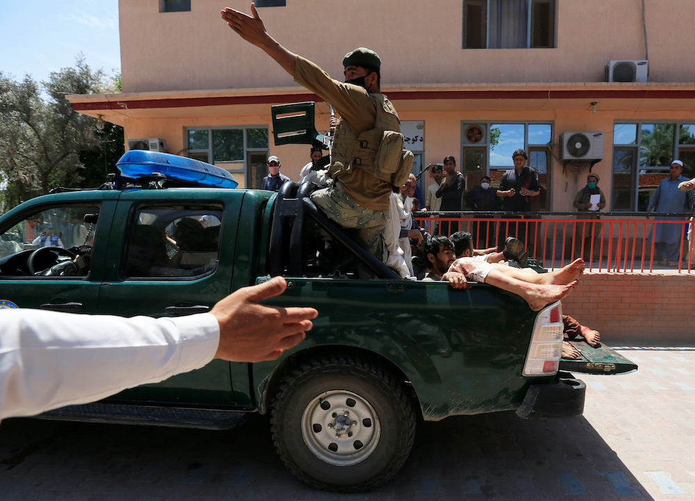 Injured persons are transferred to a hospital after a blast during a funeral ceremony in Jalalabad, Afghanistan May 12, 2020. u00e2u20acu201d Reuters pic