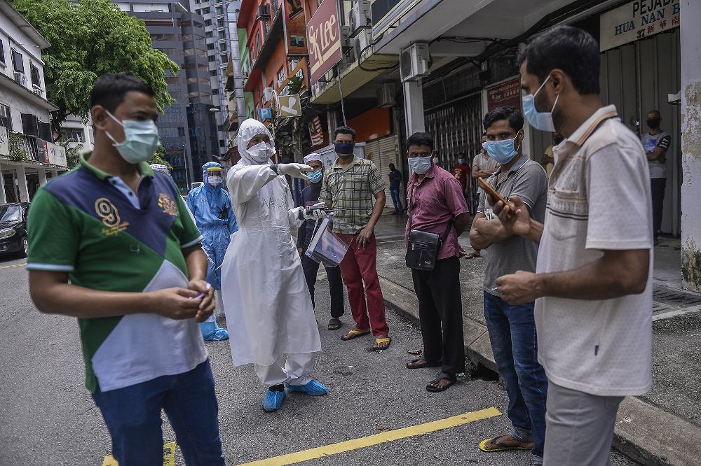 Residents and migrant workers living in the vicinity of Pudu have been ordered by the Ministry of Health and Royal Malaysian Police to conduct a Covid-19 screening May 17, 2020. u00e2u20acu201d Picture by Miera Zulyana