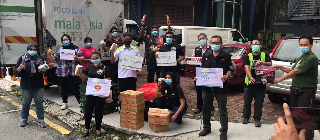 Facemasks at the ready, the volunteers went around Klang Valley to give out the rolls. —Picture courtesy of IE Asia Sdn Bhd.