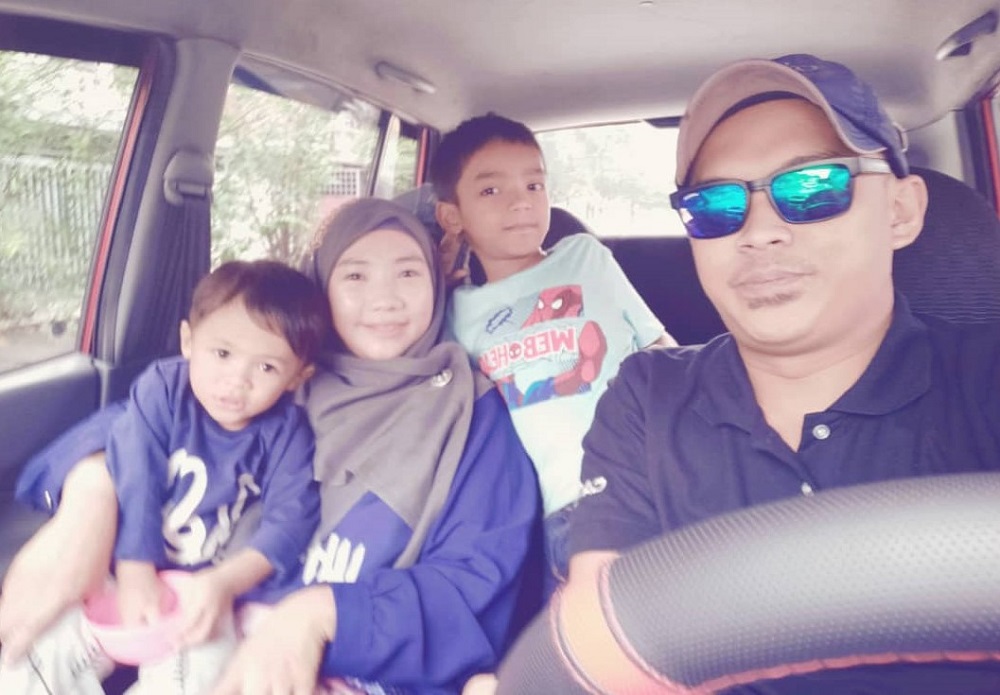 Siti Fatimah Awang with her husband and sons. She is missing her boys in Malaysia very much, having been apart from them for more than a month. — Picture courtesy of Siti Fatimah Awang via TODAY